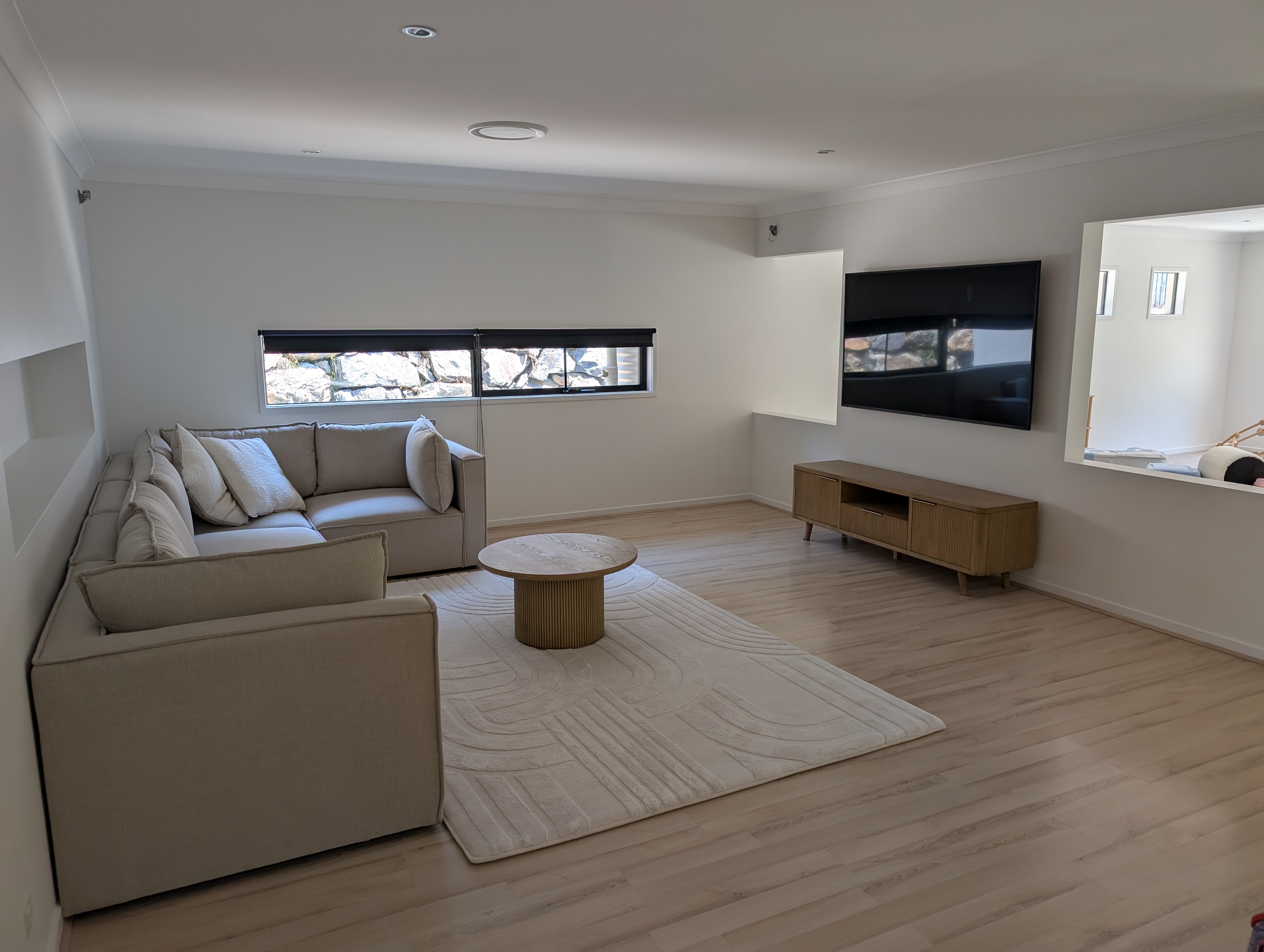 Professionally wall-mounted TV with hidden cables.