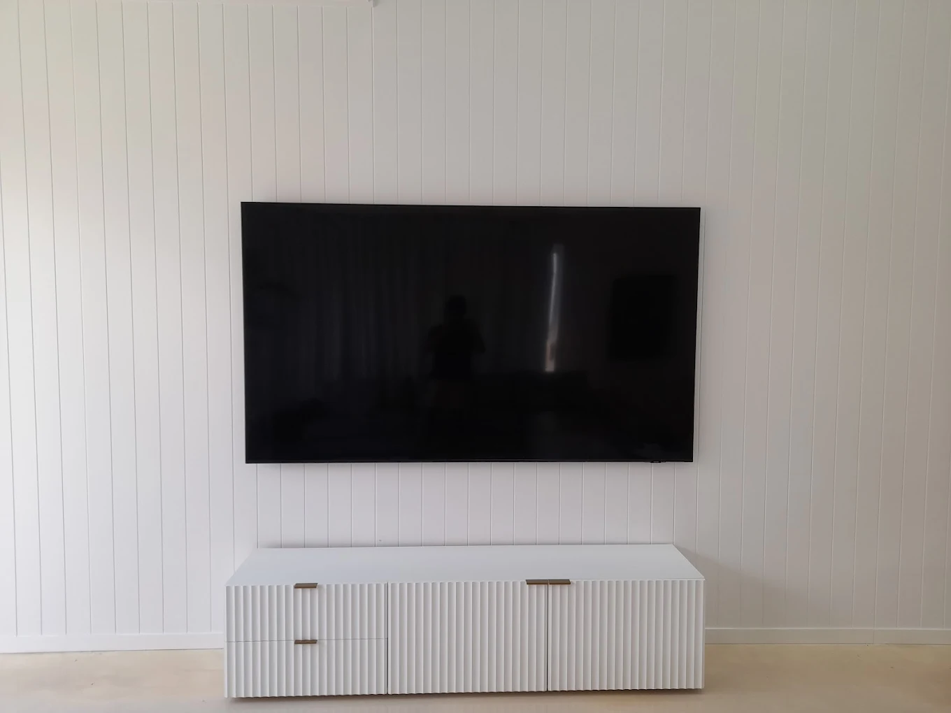 TV mounted at height.