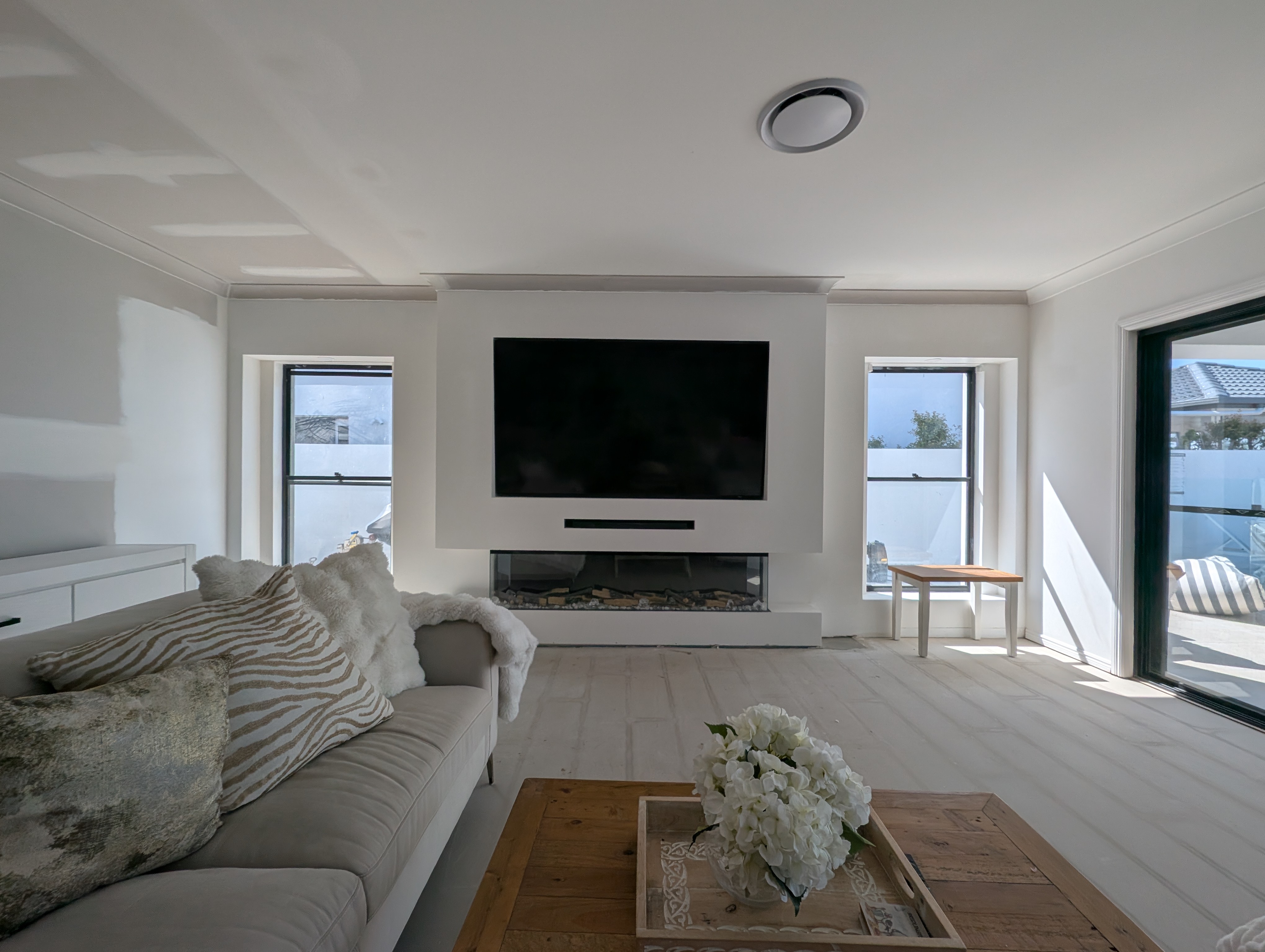 Professionally wall-mounted TV with hidden cables.